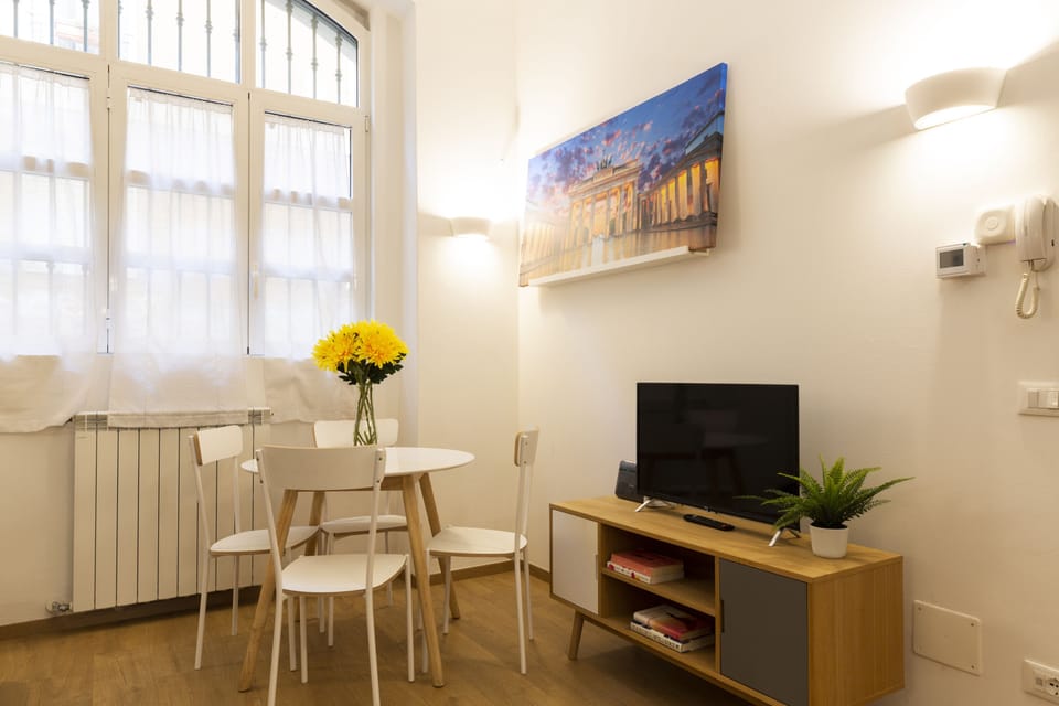 City Apartment | Living area | 32-inch flat-screen TV with digital channels, TV