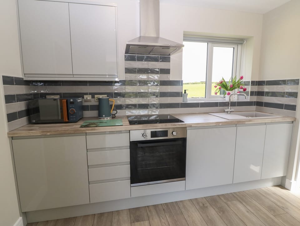 Fridge, electric kettle, toaster, cookware/dishes/utensils