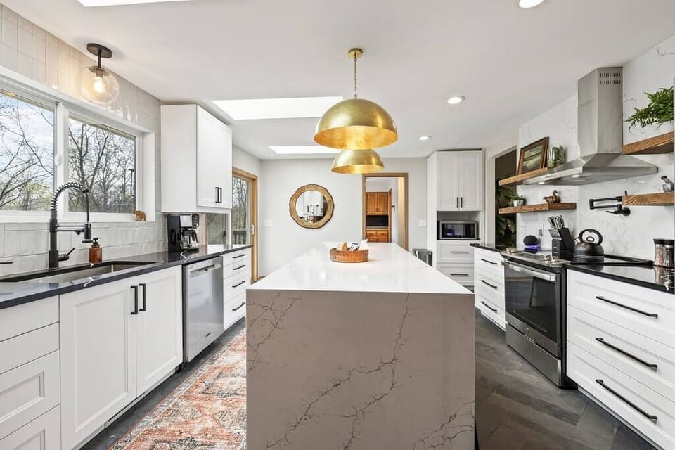 This beautiful kitchen is fully stocked w/ everything you need to cook meals for your whole family. In the morning, brew some provided coffee using the Ninja, Keurig or French Press.

3 Skylights for ample light & large windows to take in lake views!