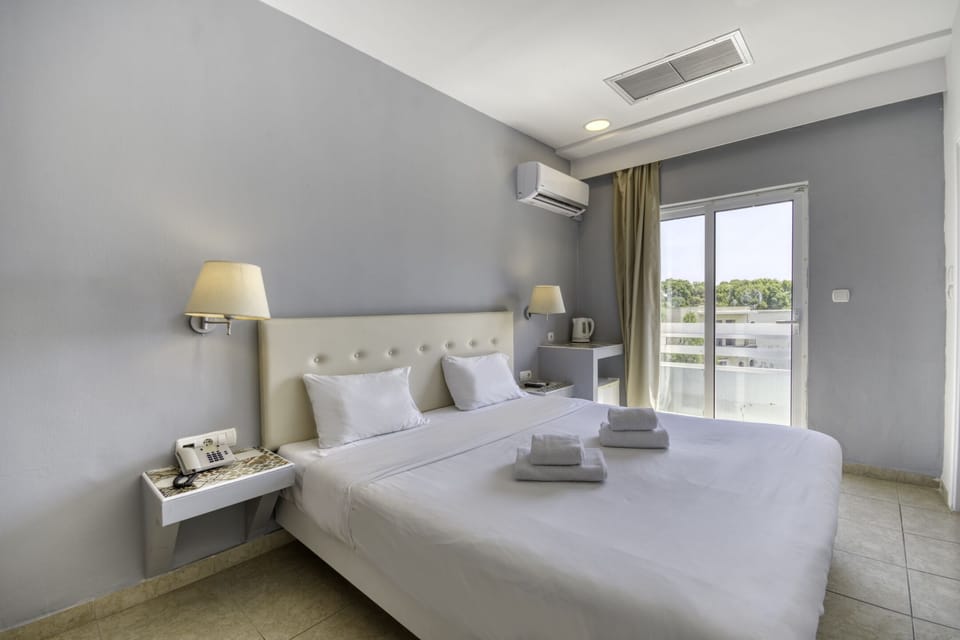 Doulbe Room with Juliet balcony | In-room safe, individually furnished, desk, blackout drapes