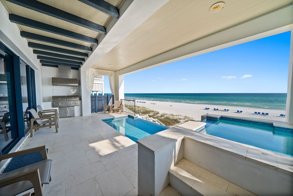Soak in your private pool while gazing at endless ocean views from this stunning beachfront terrace.
