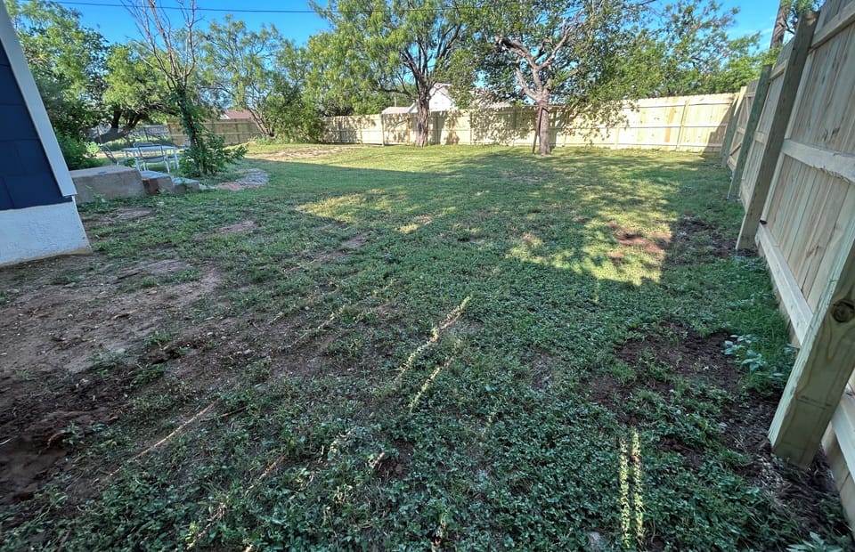 Spacious backyard fully fenced.  Parking for trailers in front of house/side st.