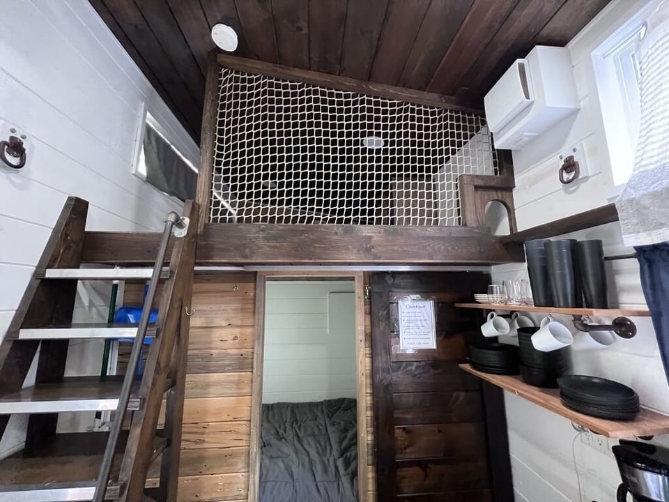 Sliding door to queen bed room, stairs to 1 of 2 lofts with double beds