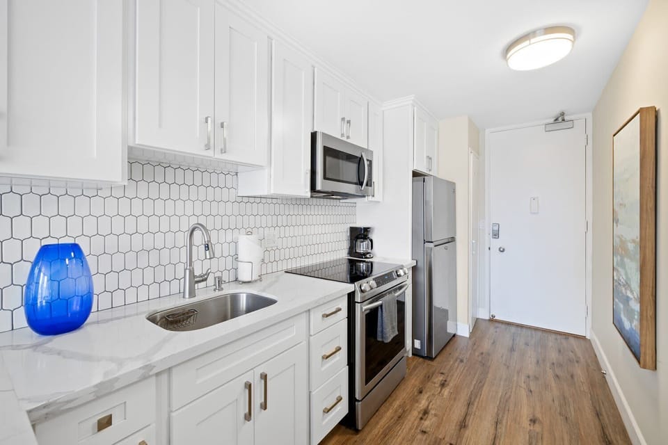 Bright and clean looking kitchen from the unit's entrance