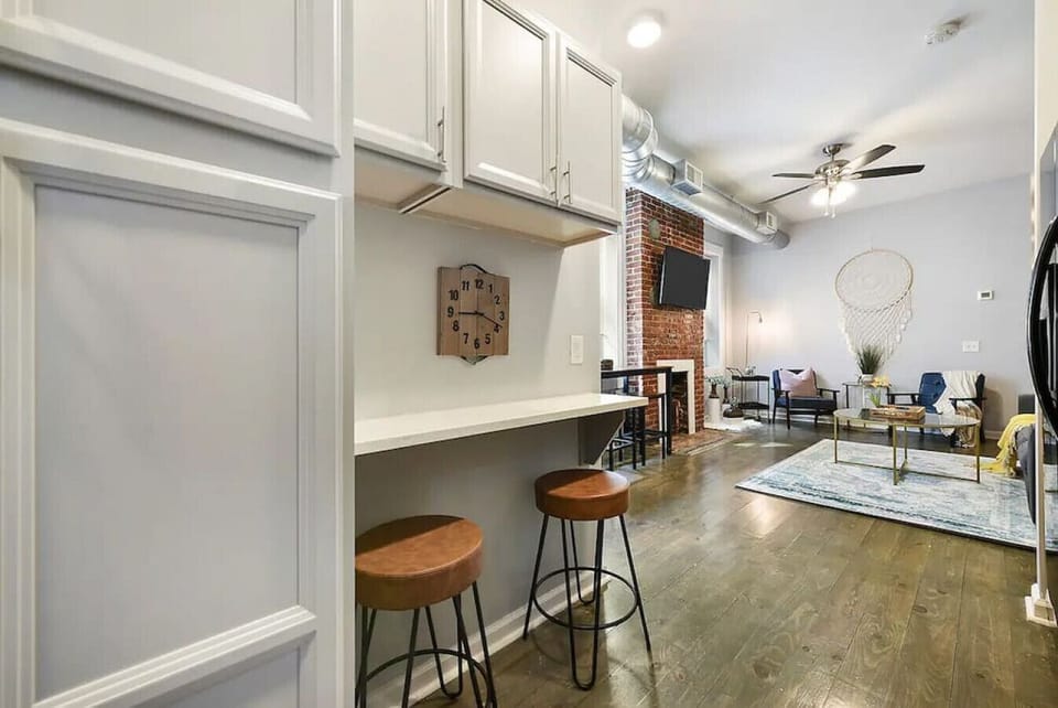 Modern kitchen with stainless steel appliances.