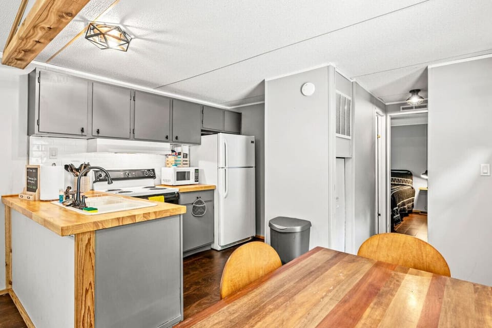 Kitchen area is located in the center of the cottage.