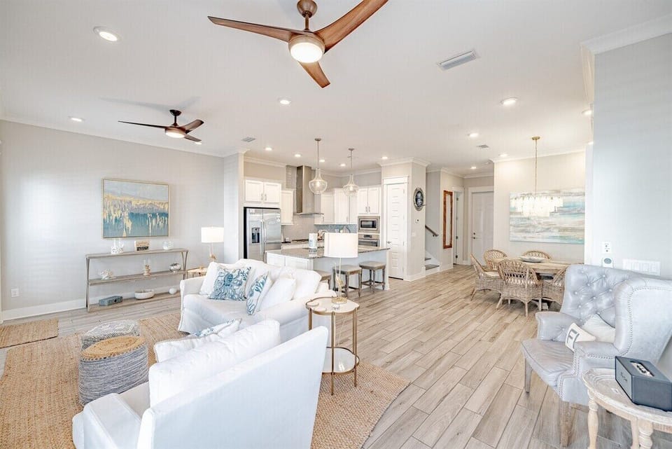 A wide-angle view of the living room and kitchen area, showcasing a harmonious blend of luxury and comfort.