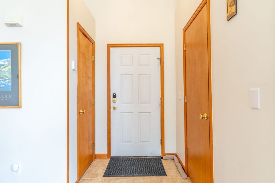 Step into your welcoming entryway with warm wood accents and clean, bright spaces that set the tone for your comfortable stay.