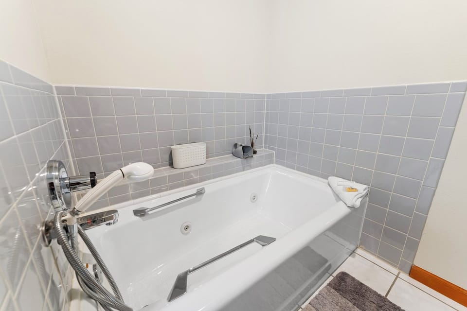 Sink into your private whirlpool tub after a day of exploring, with handheld shower and thoughtful amenities for pure relaxation.