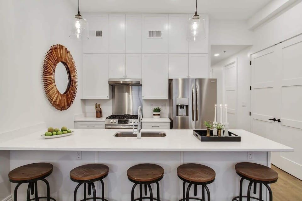 Kitchen | Fully Equipped with Essential Cookware and Large Island with Seating | First Floor