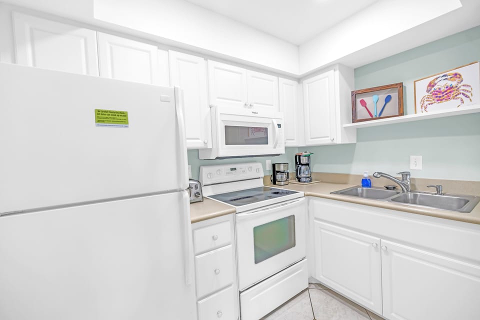 Plenty of counter space and full-sized fridge.
