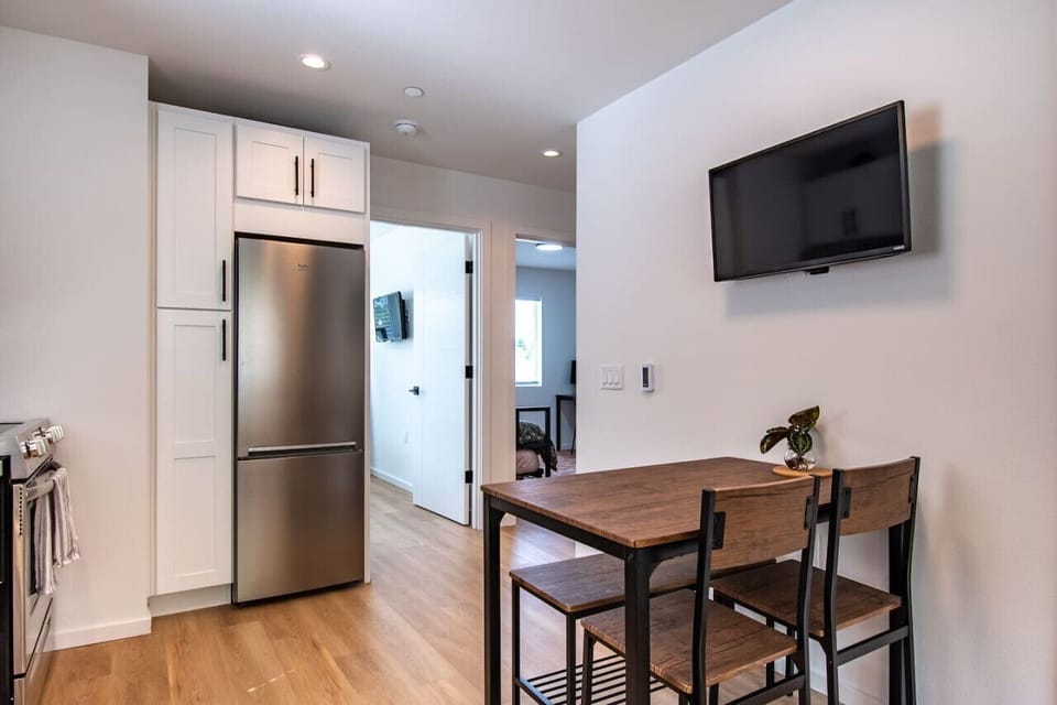 Enjoy a fridge for freshness, a TV for entertainment, and a simple table that’s perfect for casual meals.