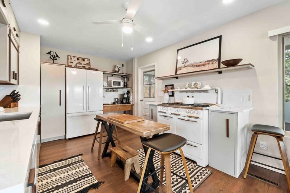 A view of the oven, stove, and island in the kitchen