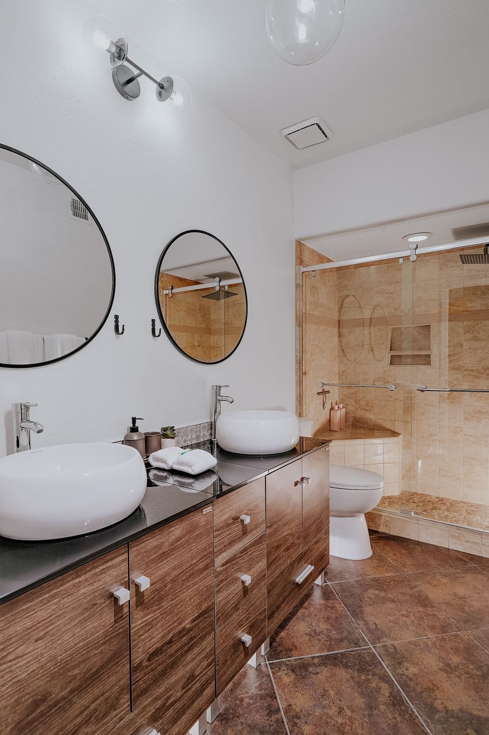 Private master bath with dual sink, luxury towels, and bath products
