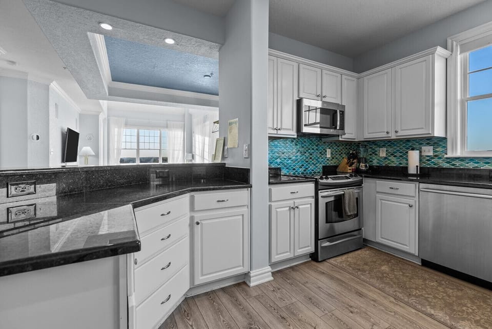 The kitchen is fully equipped with essential appliances and cookware, allowing guests to prepare meals conveniently during their stay.