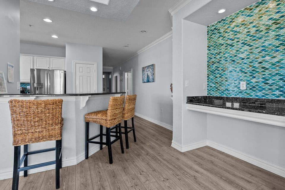 A countertop that extends to the kitchen invites you to share your meals and stories with your loved ones.