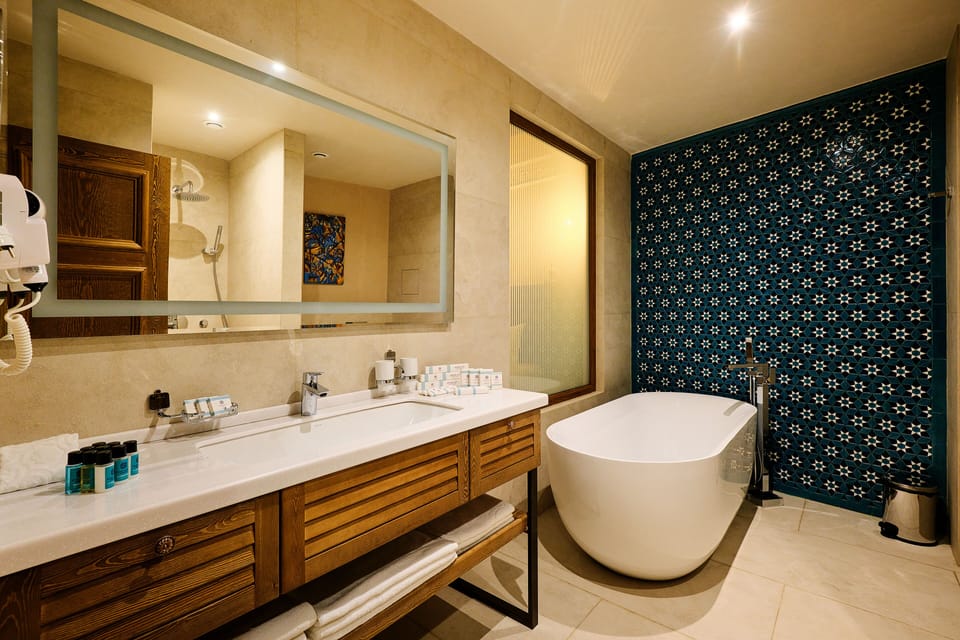 Family Triple Room | Bathroom | Hair dryer, bathrobes, slippers, towels