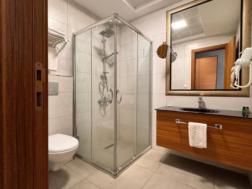 Shower, rainfall showerhead, designer toiletries, hair dryer