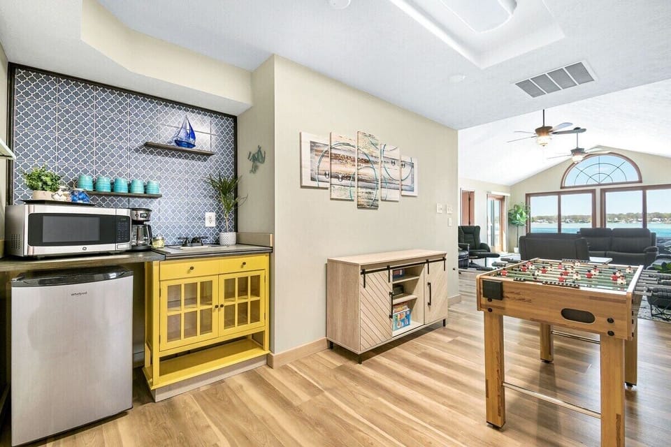 Upstairs kitchenette & gameroom with coffee maker, fussball table, and air hockey!