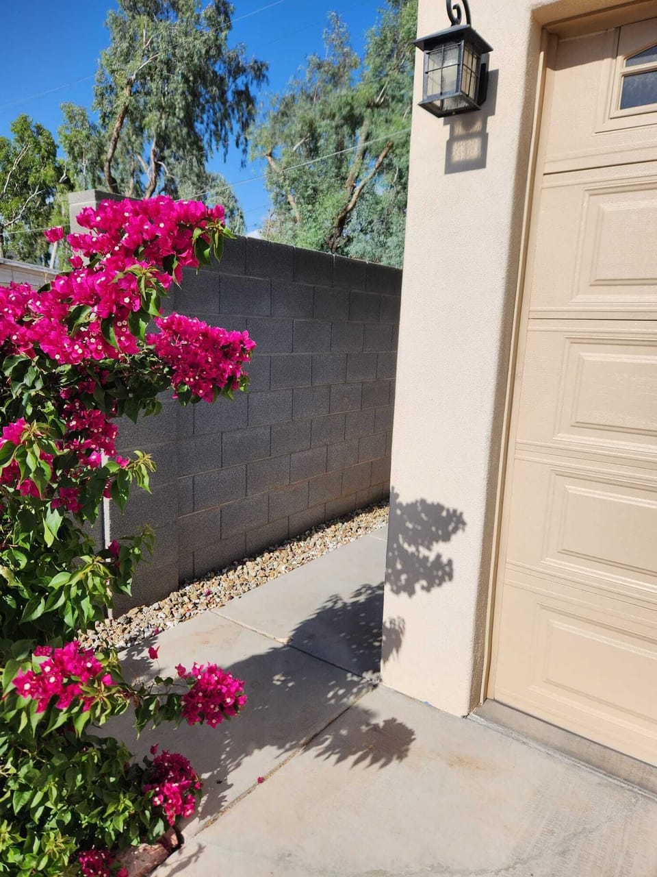 Follow the lighted pathway on the North side of the garage to access the stairs.