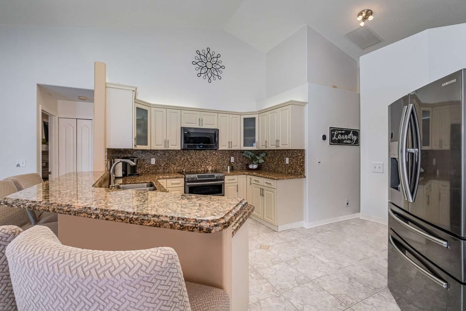Spacious kitchen area with ample high-top sitting space