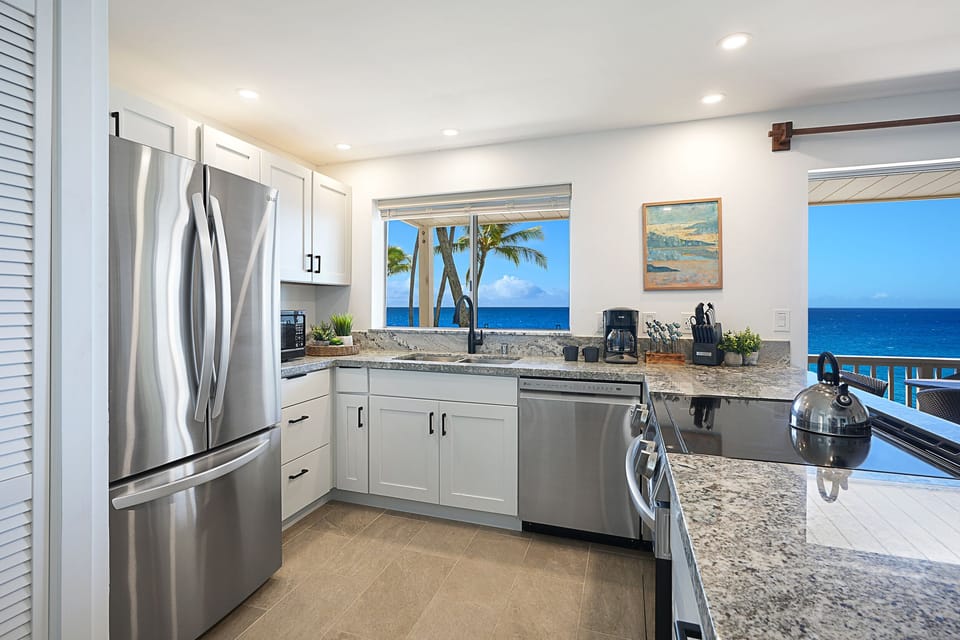 New stainless appliances, granite countertops and new cabinetry in the kitchen