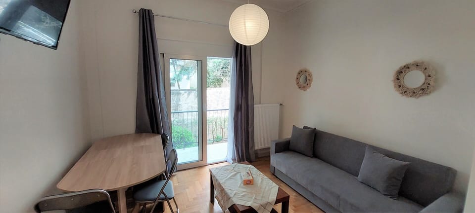 City Apartment | Living area | 24-inch TV with digital channels