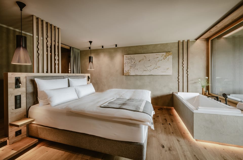 Luxury Suite | Living area | 58-inch flat-screen TV with cable channels, TV
