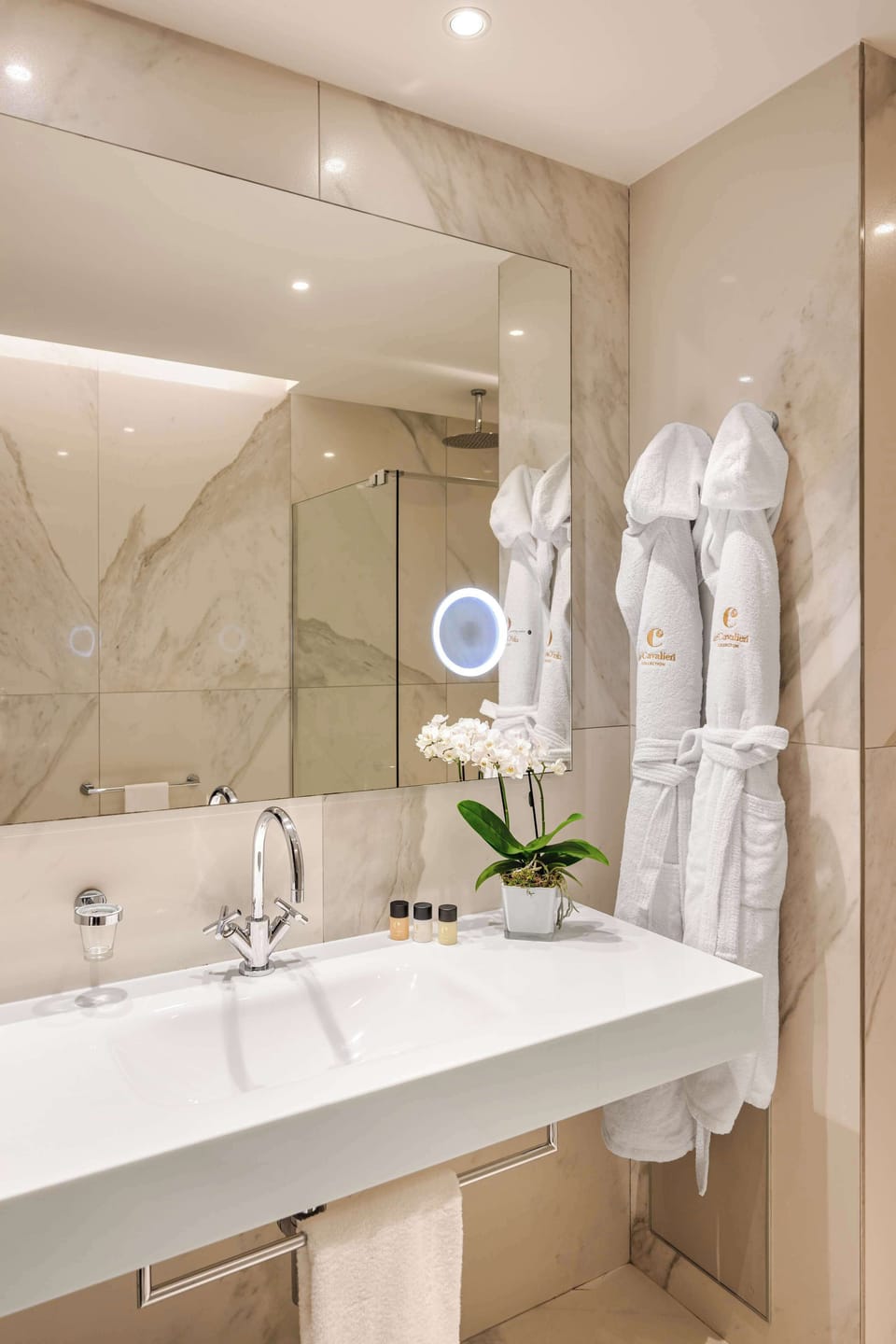 Shower, rainfall showerhead, slippers, towels