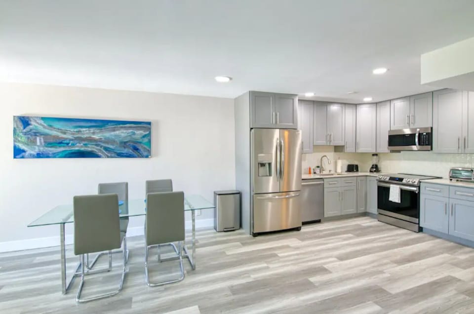 Sleek kitchen and dining area with plenty of space to gather.