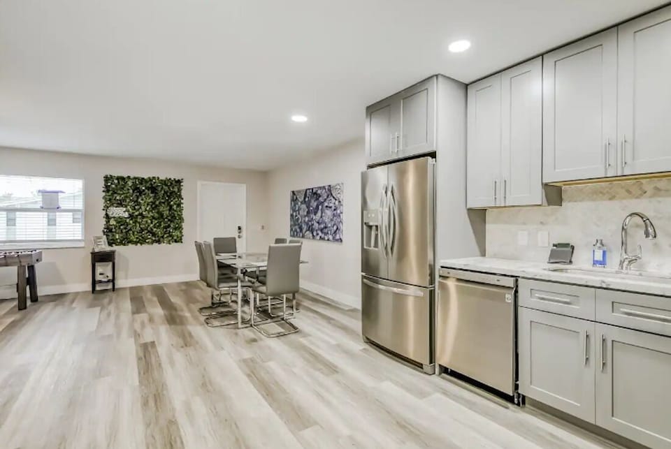 Modern open kitchen and dining space made for easy gatherings.