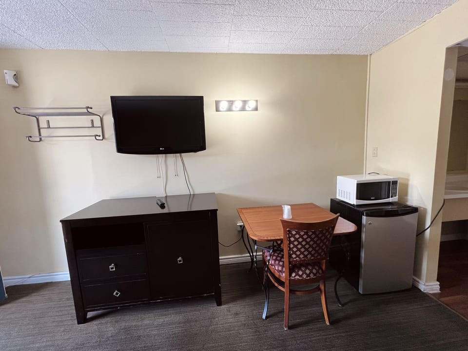 Standard Room, 2 Double Beds | Living area | TV