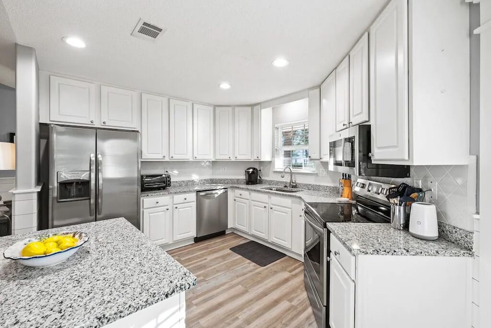 Bright open, fully stocked kitchen 
