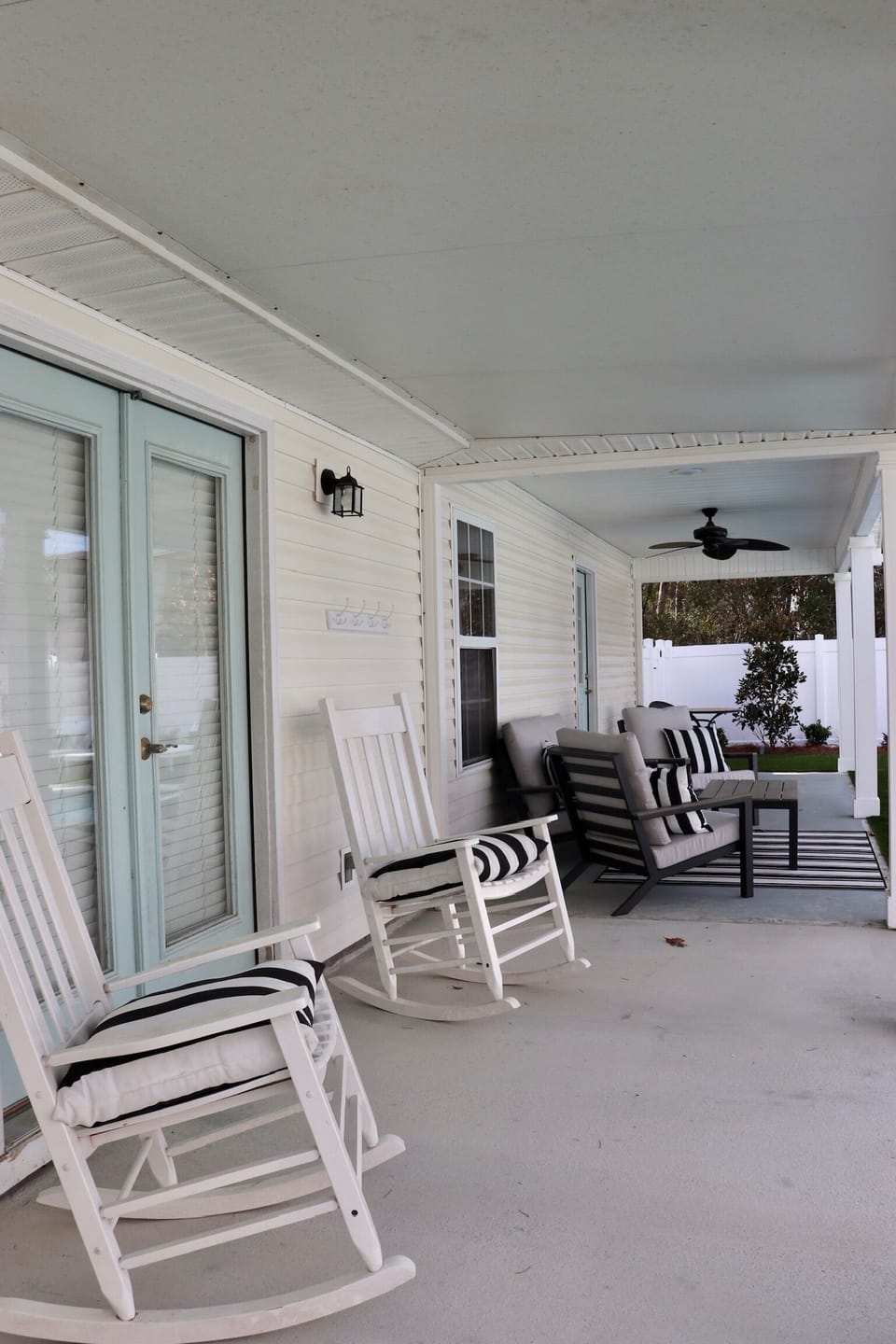 Covered back patio overlooking the pool.