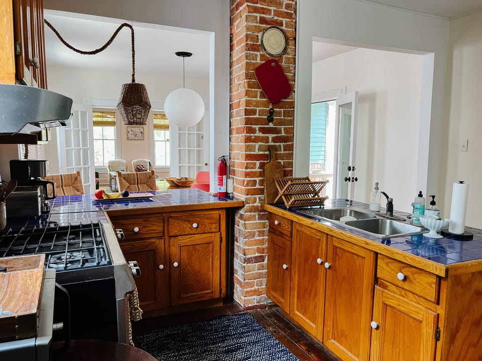 Coffee maker, toaster oven, microwave in the small kitchen 