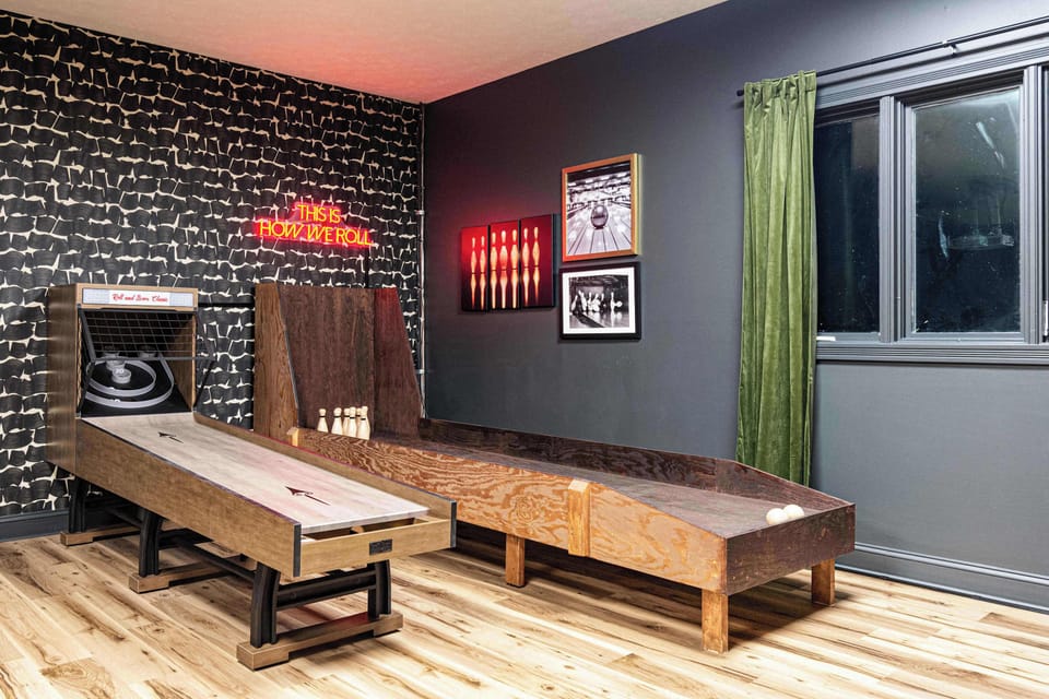 One of many large game rooms, this room is outfit with a professional grade golf simulator, skeeball, basketball and a miniature bowling alley. Epic fun for all generations. 