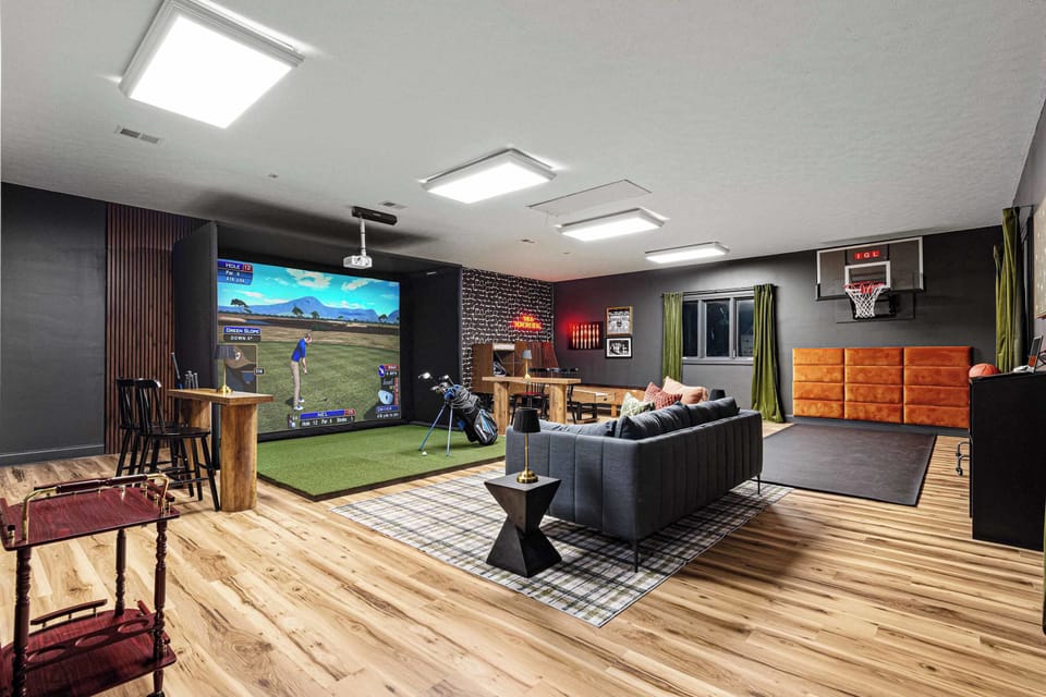 One of many large game rooms, this room is outfit with a professional grade golf simulator, skeeball, basketball and a miniature bowling alley. Epic fun for all generations. 