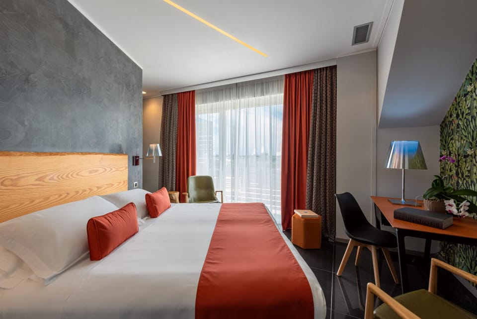 Junior Suite, Pool View | Premium bedding, memory foam beds, minibar, in-room safe