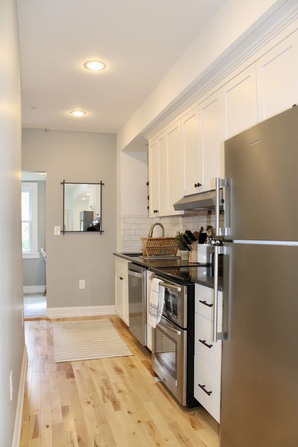 Second floor: fully stocked galley kitchen off the living room
