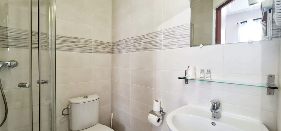 Shower, free toiletries, hair dryer, towels