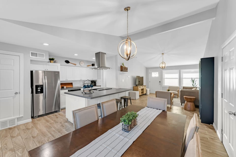 Open kitchen and 3 bar stools for additional seating.