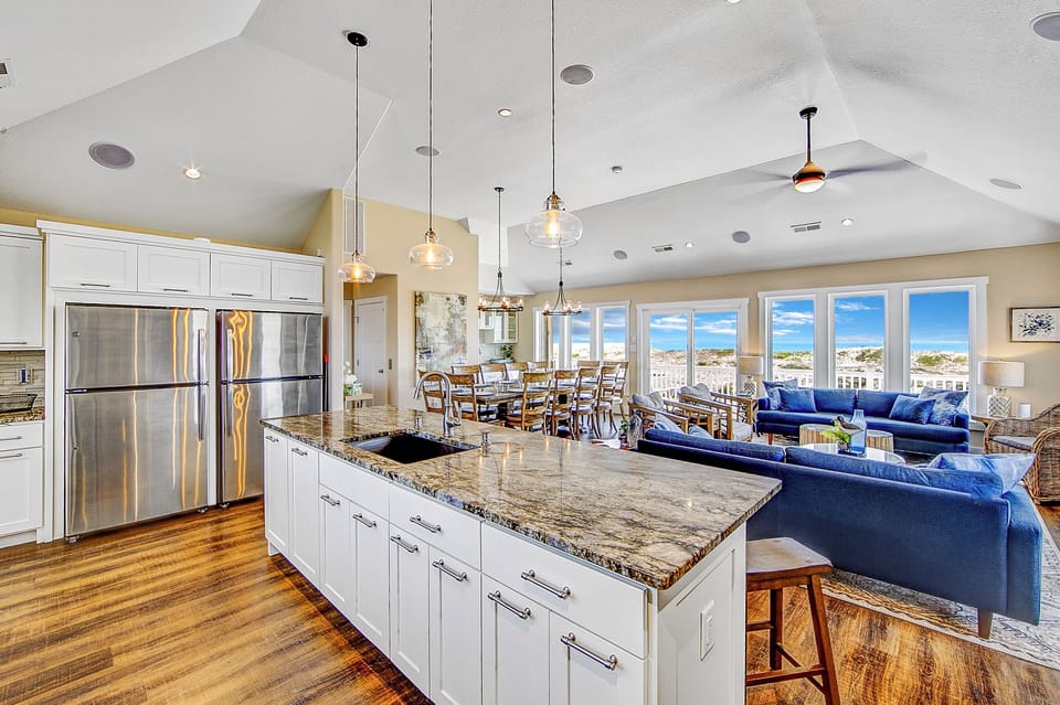 Gather in Style: spacious great room and gourmet kitchen.
