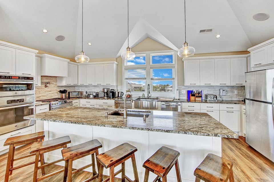 Gourmet Kitchen is equipped with double refrigerators, gas and an electric stoves, built-in microwave and 2 dishwashers 