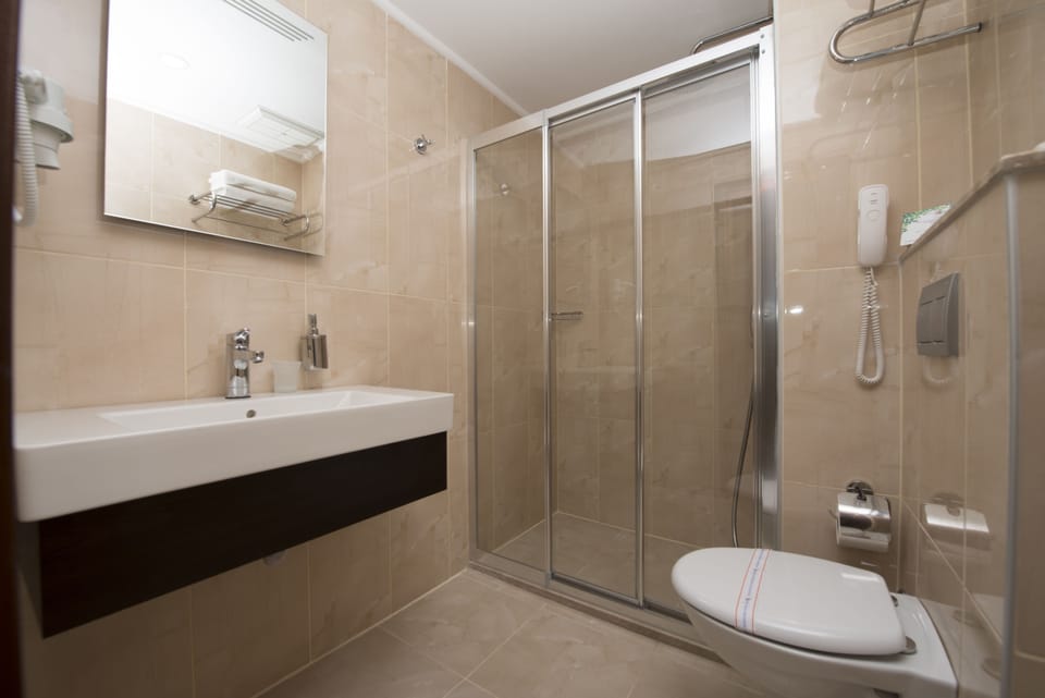 Shower, free toiletries, hair dryer, towels