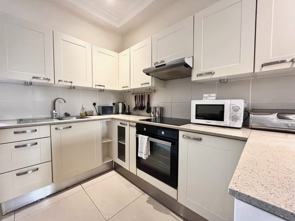 Superior Two Bedroom Apartment | Private kitchen | Microwave, coffee/tea maker, electric kettle, cookware/dishes/utensils