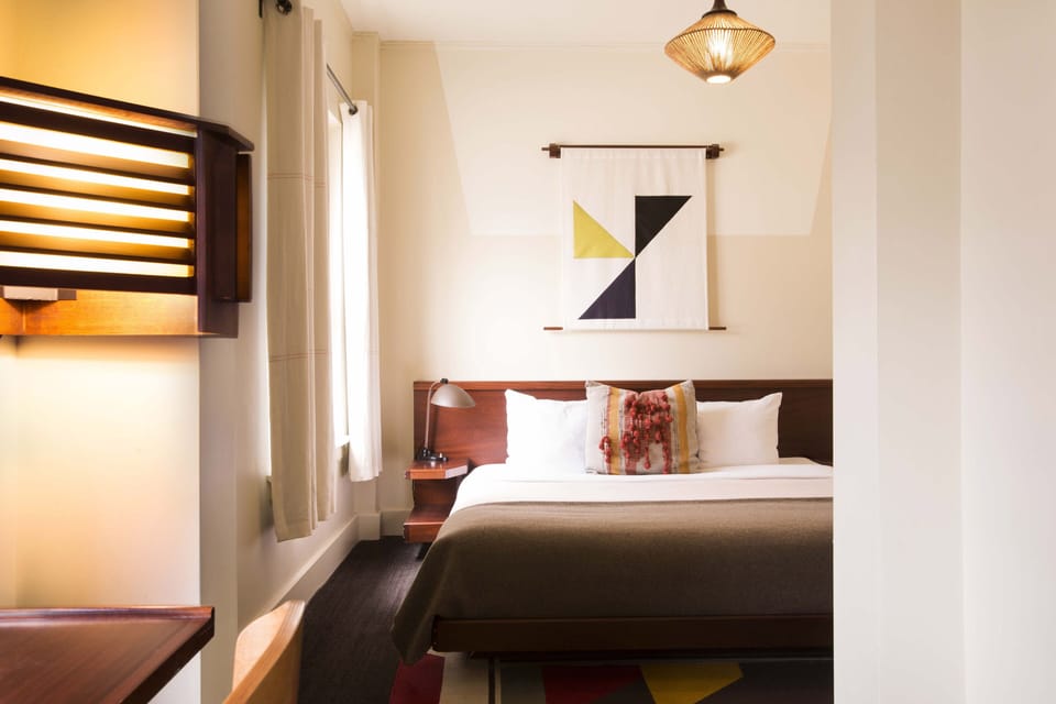 Premium King | Premium bedding, in-room safe, blackout drapes, iron/ironing board
