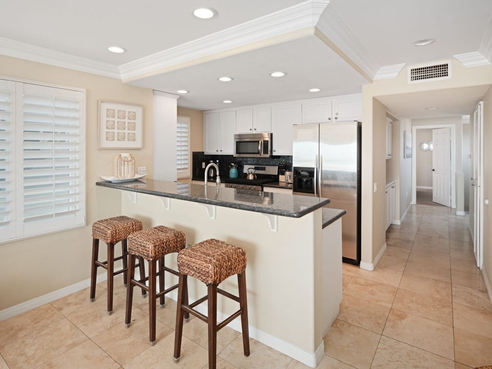 Marble countertops, sleek finishes, and fully stocked with tableware, cookware, and glassware for a refined cooking experience.