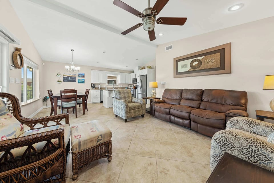 Relax in the open great room with vaulted ceilings and easy coastal style