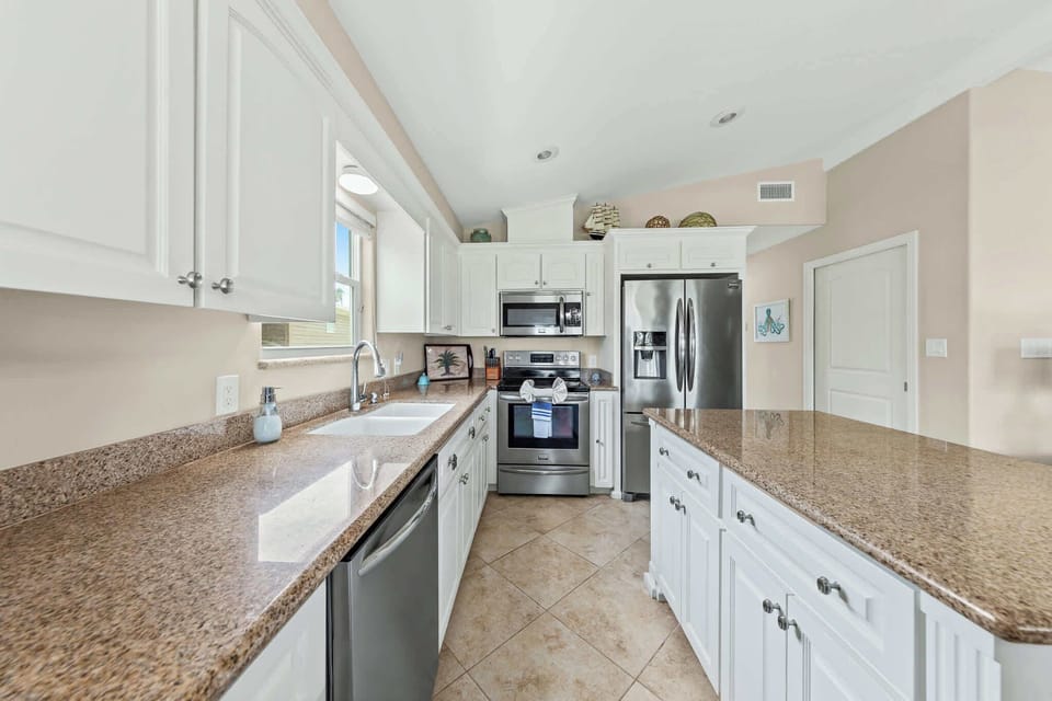 Cook with granite counters and full stainless steel appliances