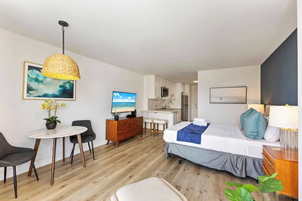 Open-concept living room and kitchen, perfect for enjoying meals or relaxing on the chair while taking in the cozy atmosphere.